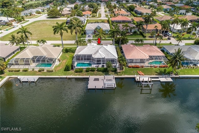 bird's eye view featuring a residential view and a water view