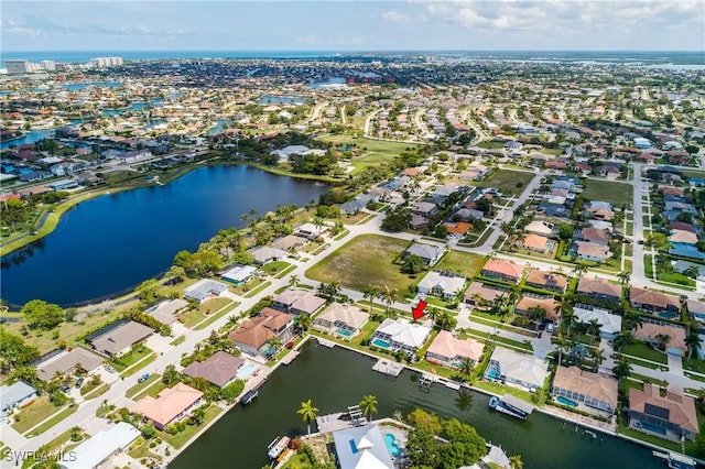 bird's eye view featuring a residential view and a water view