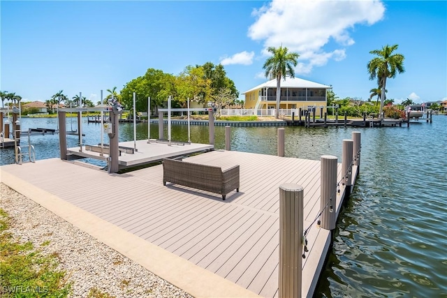 view of dock with a water view and boat lift