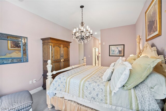 carpeted bedroom featuring a notable chandelier