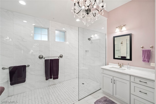 bathroom with an enclosed shower, a notable chandelier, vanity with extensive cabinet space, and tile flooring