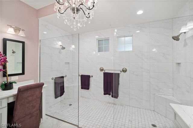 bathroom with vanity, an enclosed shower, and a chandelier