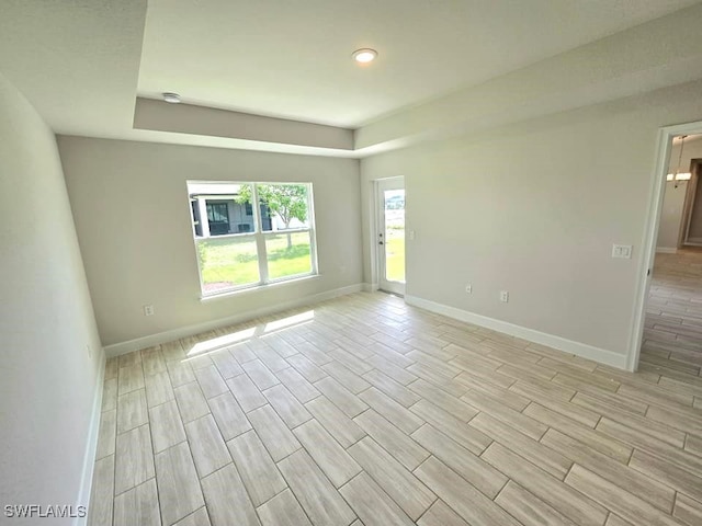 empty room with light hardwood / wood-style flooring