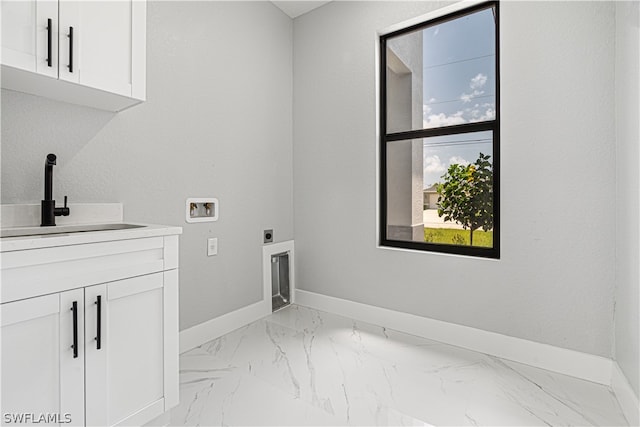 washroom featuring cabinets, hookup for a washing machine, sink, and electric dryer hookup