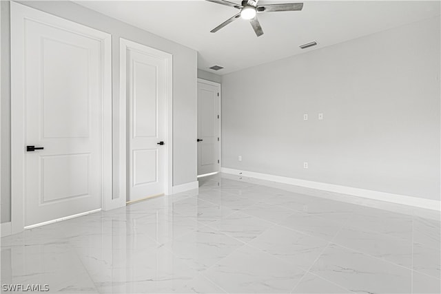 unfurnished bedroom featuring ceiling fan