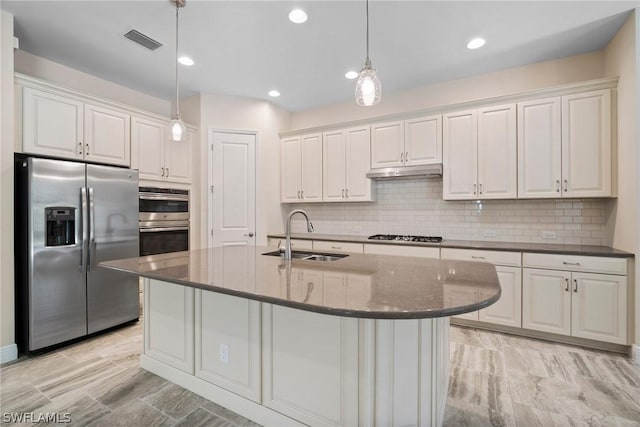 kitchen featuring white cabinetry, visible vents, stainless steel appliances, and a sink