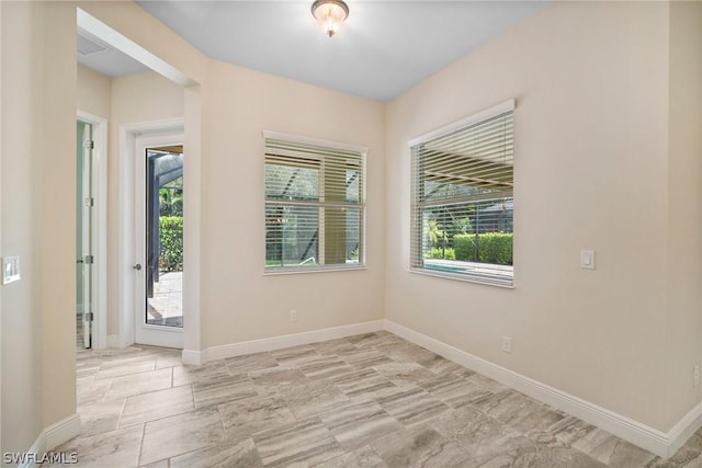 interior space featuring baseboards