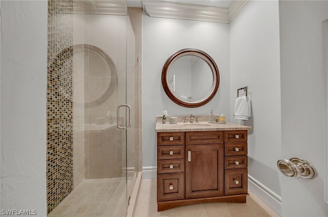 bathroom with vanity, a shower with door, and crown molding