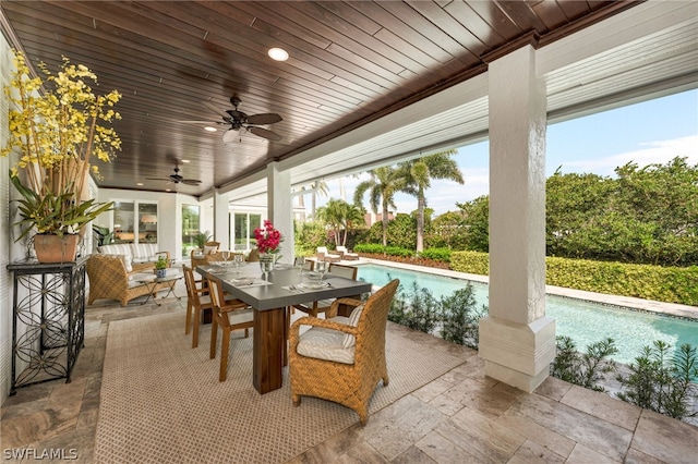 exterior space with ceiling fan and an outdoor living space