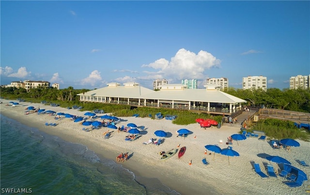 birds eye view of property featuring a view of the beach and a water view