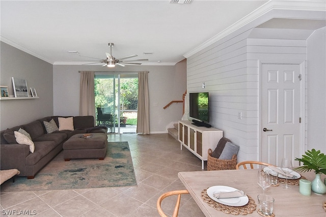 tiled living room with ceiling fan and ornamental molding