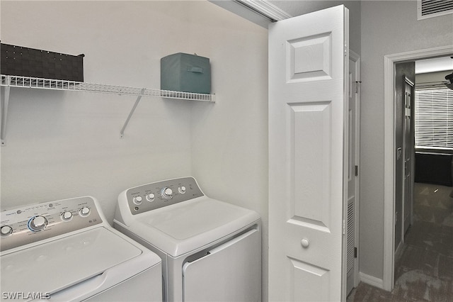 laundry area featuring washing machine and clothes dryer