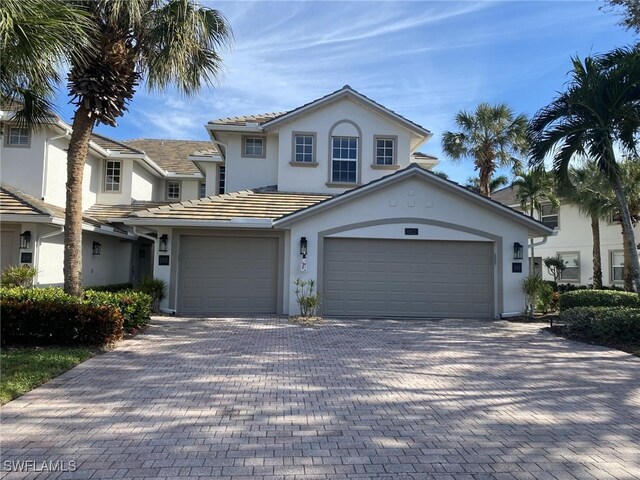 front facade with a garage