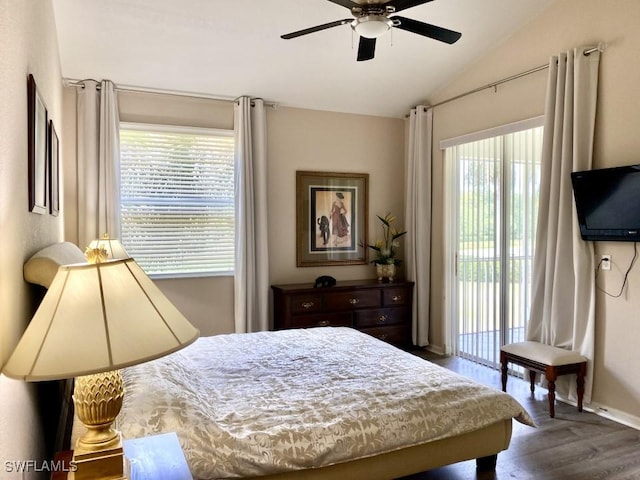 bedroom featuring access to exterior, ceiling fan, hardwood / wood-style floors, and vaulted ceiling