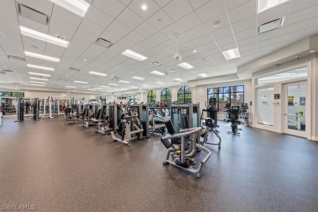 workout area featuring a drop ceiling