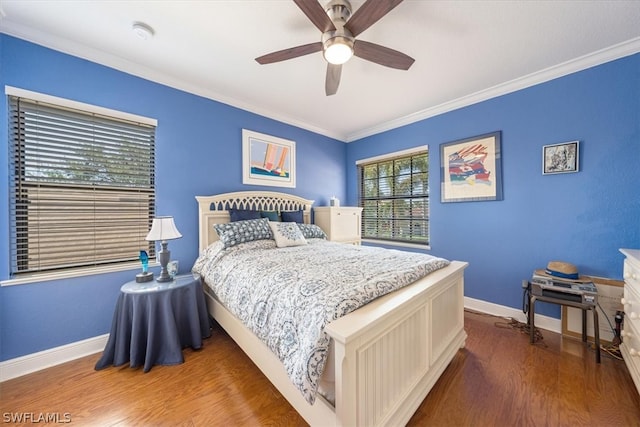 bedroom with crown molding, wood-type flooring, and ceiling fan