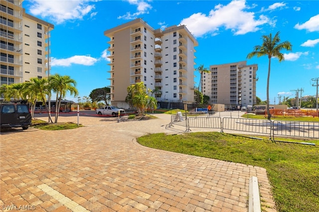 view of property's community with a lawn