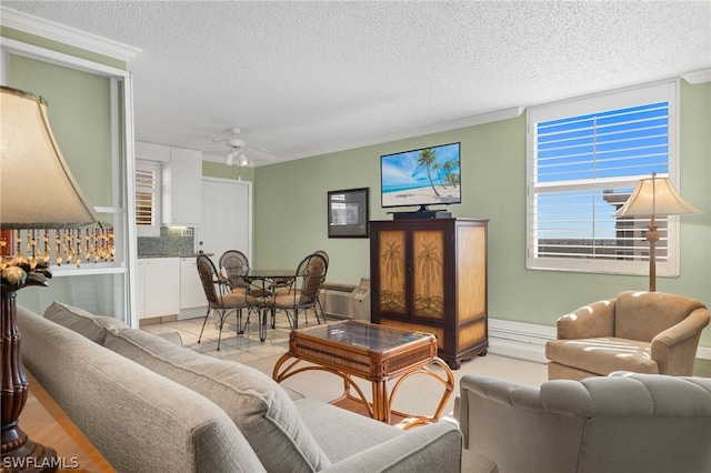 living room featuring a textured ceiling, ornamental molding, ceiling fan, and light tile floors