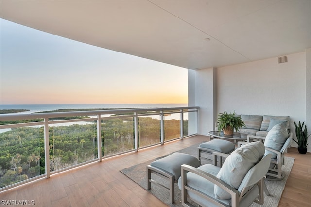 balcony at dusk with a water view