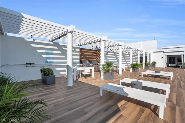 wooden terrace with a pergola