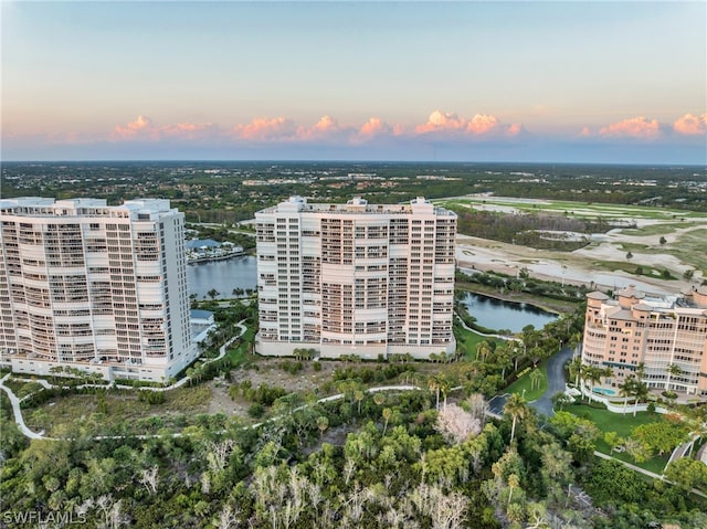 aerial view at dusk with a water view