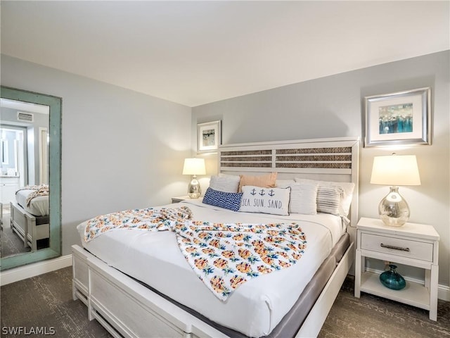 bedroom featuring dark hardwood / wood-style floors