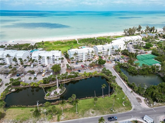 bird's eye view featuring a water view and a view of the beach