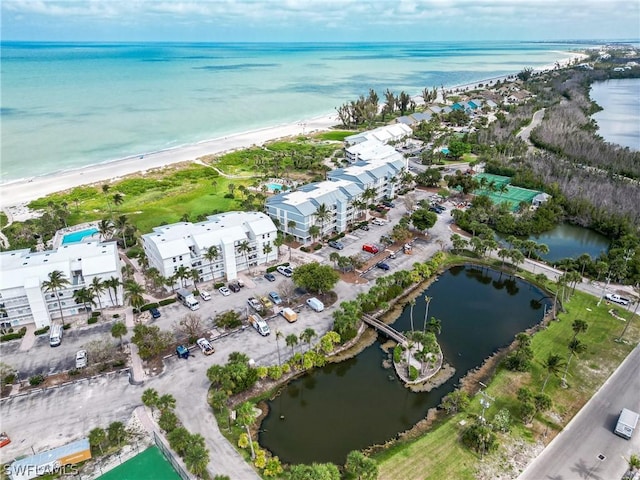 aerial view with a view of the beach and a water view