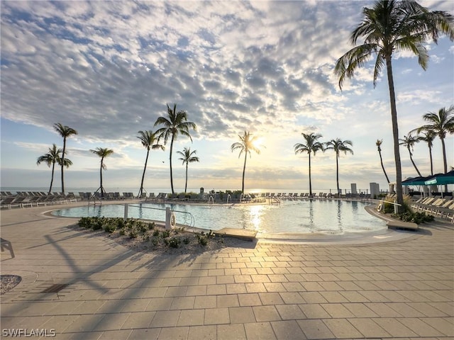 pool at dusk with a water view