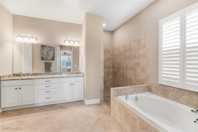 full bathroom with double vanity, a sink, walk in shower, and a bath