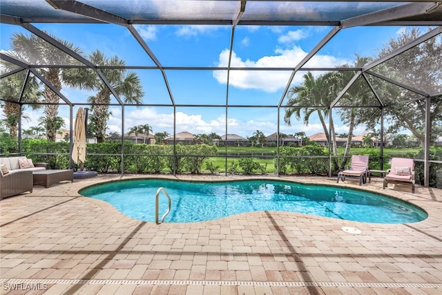 pool with glass enclosure, an outdoor living space, and a patio area