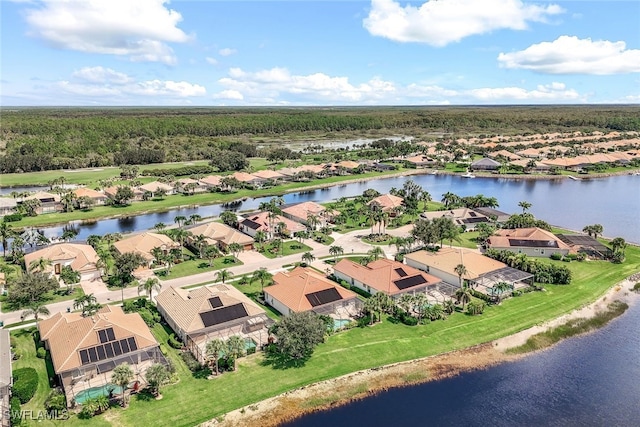 birds eye view of property with a residential view and a water view