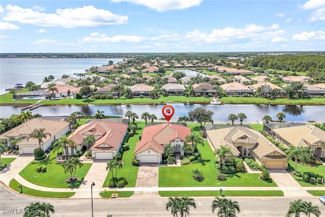 bird's eye view featuring a residential view and a water view