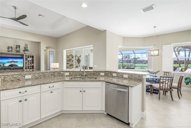 kitchen featuring ceiling fan with notable chandelier, white cabinets, dishwasher, and sink