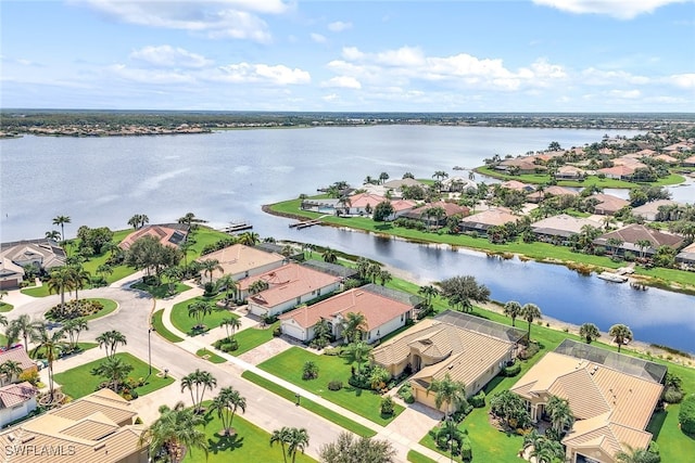 aerial view featuring a water view and a residential view