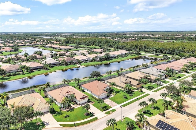 bird's eye view with a residential view and a water view