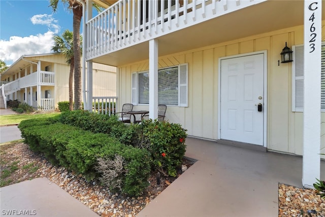 entrance to property with a balcony