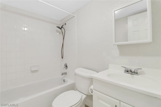 full bathroom featuring toilet, tiled shower / bath combo, and oversized vanity