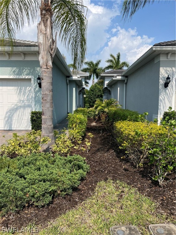 view of property exterior featuring a garage