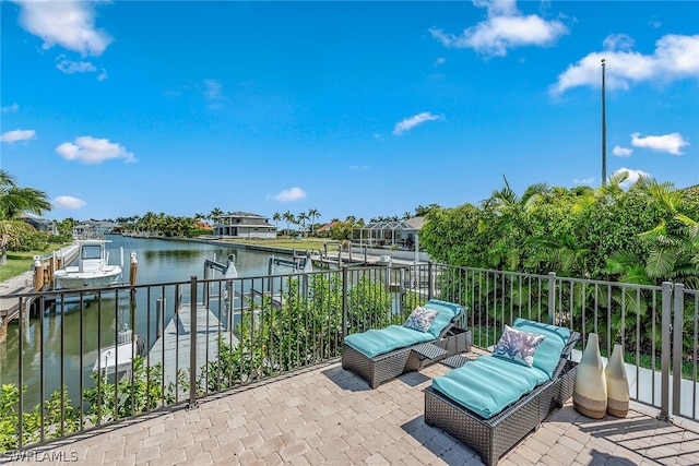 view of patio featuring a boat dock and a water view