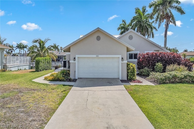 view of front of house with a garage and a front lawn