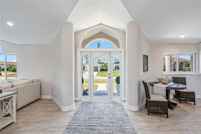 foyer entrance featuring plenty of natural light and light tile floors