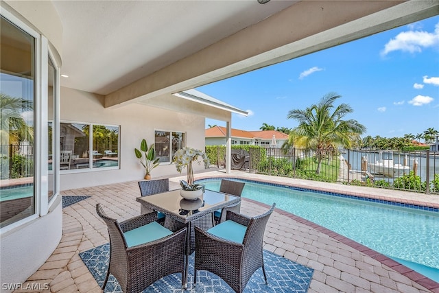 view of terrace with a fenced in pool