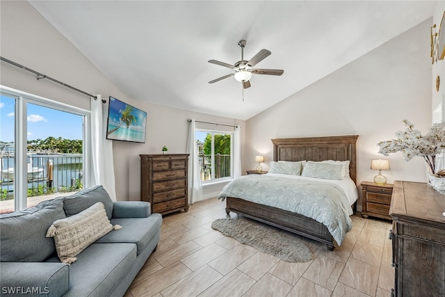 bedroom with ceiling fan, light tile floors, and lofted ceiling