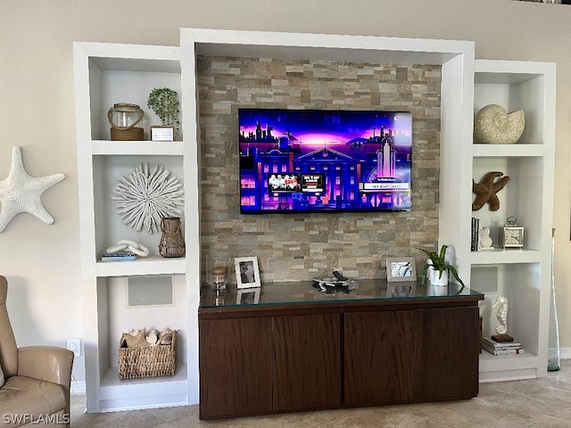 bar featuring built in shelves, tile flooring, and dark brown cabinetry