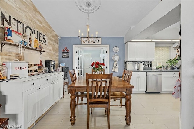 dining area featuring an inviting chandelier