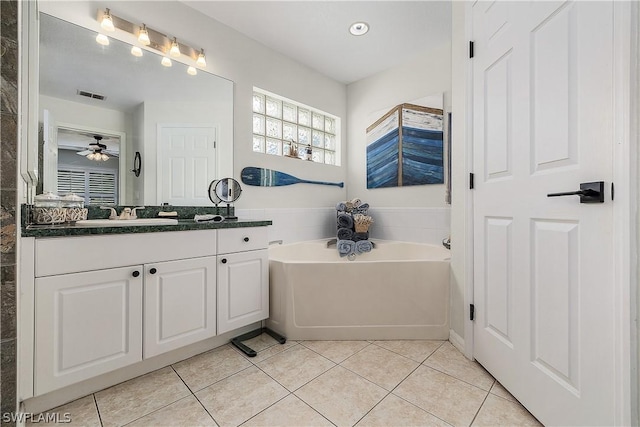 bathroom featuring a bath, vanity, tile patterned floors, and ceiling fan