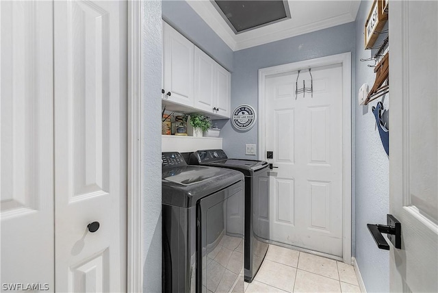 washroom with cabinets, ornamental molding, light tile patterned floors, and separate washer and dryer