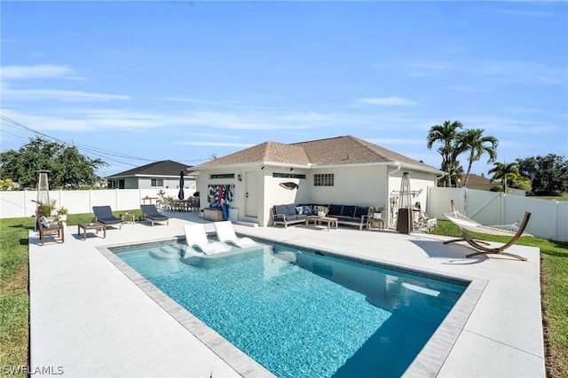 view of swimming pool with a patio area and an outdoor hangout area