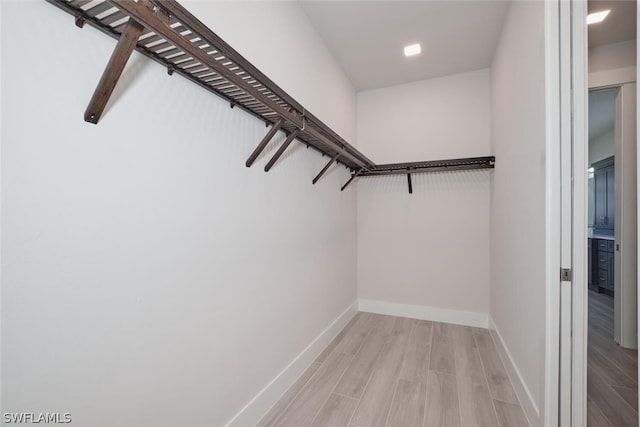 walk in closet featuring light wood-type flooring